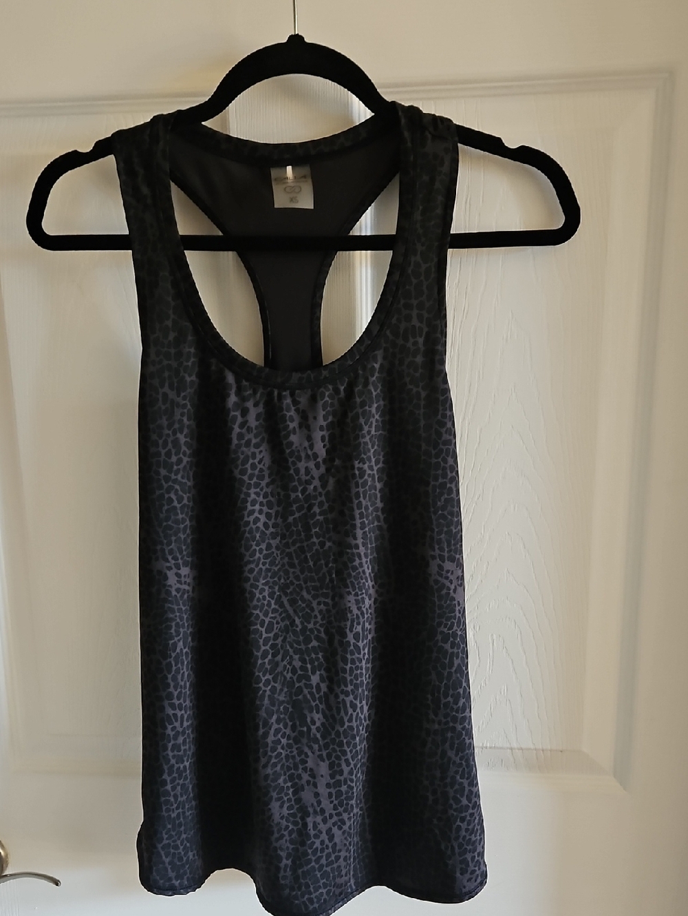 CALIA by Carrie Underwood Black Tag on Dark Gray Fabric